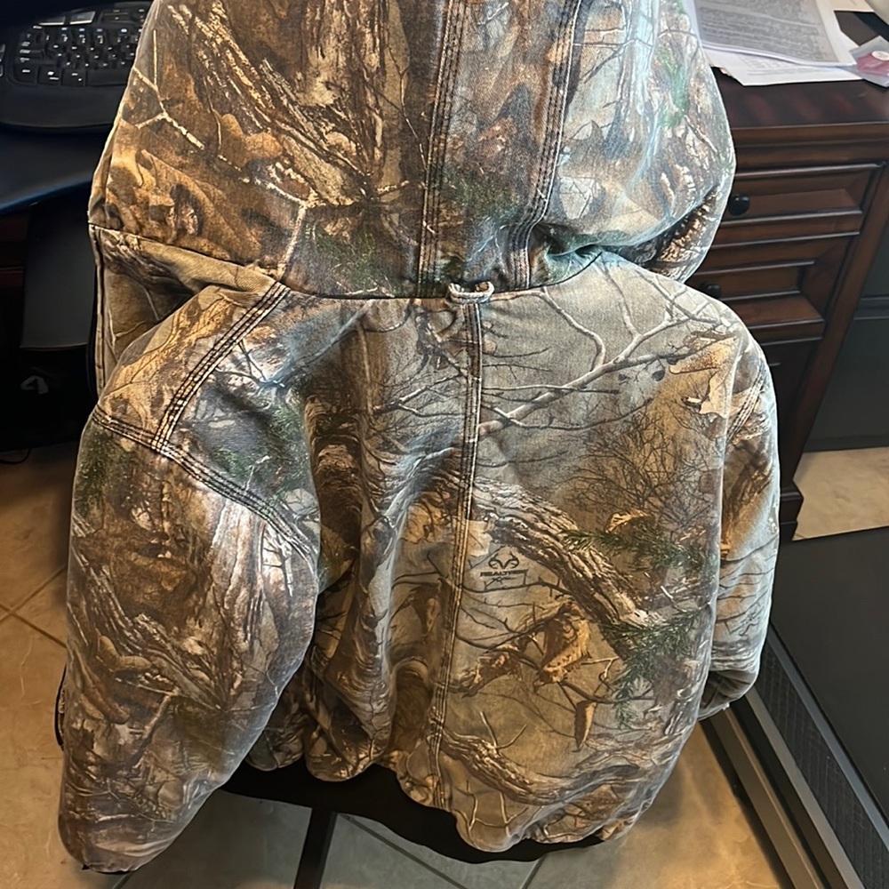 Extra large boys hunting jacket. Small tear in right shoulder